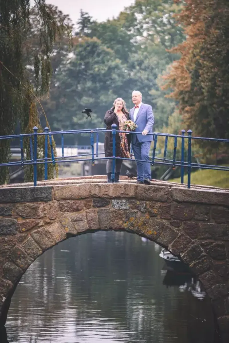 Couple on a canal bridge in Friedrichstadt