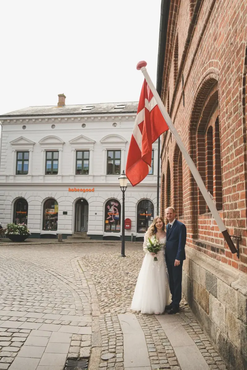 Couple in front of a Danish flag in Ribe